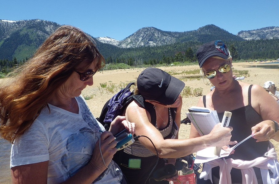 Members of the N.E.R.D.S. group test water quality with specialized tools