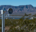 An instrument for remote monitoring and data collection in the foreground of the desert landscape