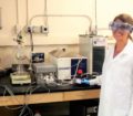 Coral Taylor, University of Nevada, Reno Graduate Student poses with the Bench-Scale Membrane Distillation System