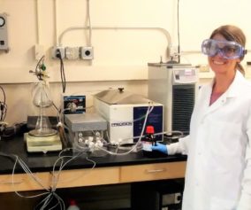 Coral Taylor, University of Nevada, Reno Graduate Student poses with the Bench-Scale Membrane Distillation System