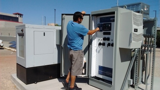 Graduate Student Christopher Hicks at control panel