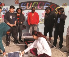 Cover of Discoveries Magazine Feb 2018, Students explore solar concepts with a classroom solar kit.